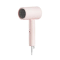 Pink hair dryer on a white background