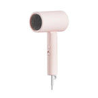 Pink hair dryer on a white background