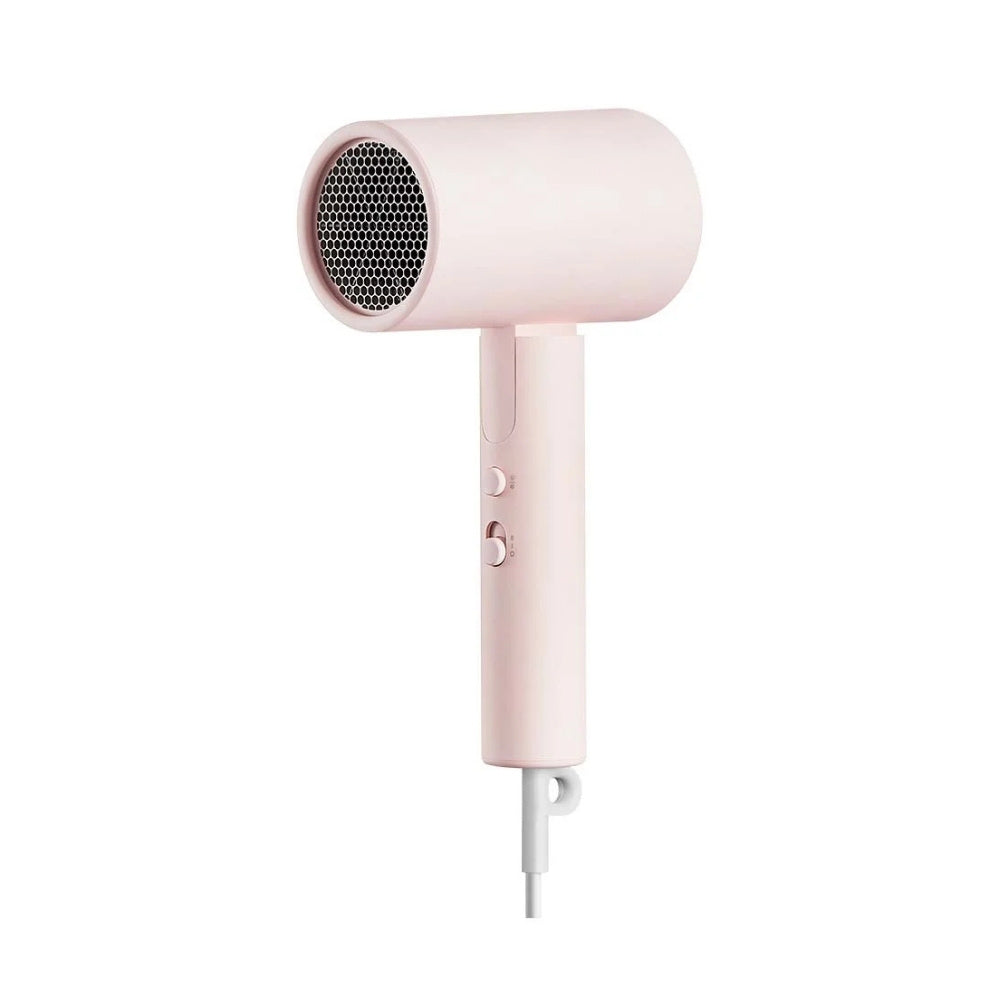 Pink hair dryer on a white background