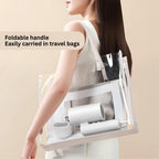 Woman carrying a transparent tote bag with white cylindrical items, text 'Foldable handle Easily carried in travel bags' on beige background.