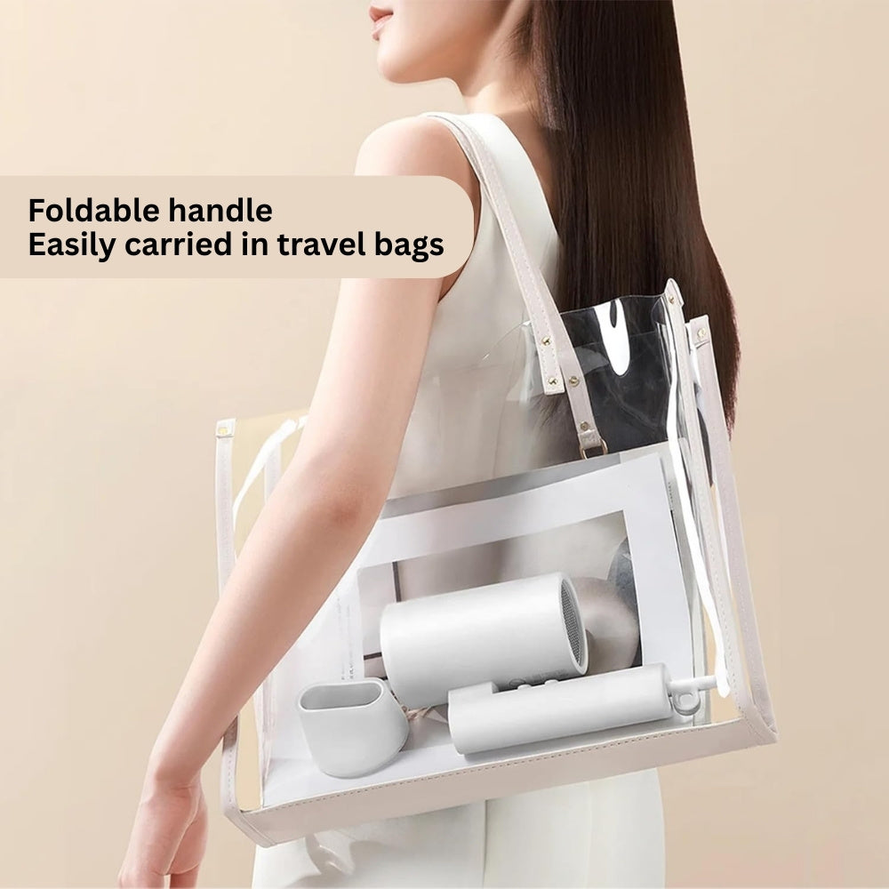 Woman carrying a transparent tote bag with white cylindrical items, text 'Foldable handle Easily carried in travel bags' on beige background.
