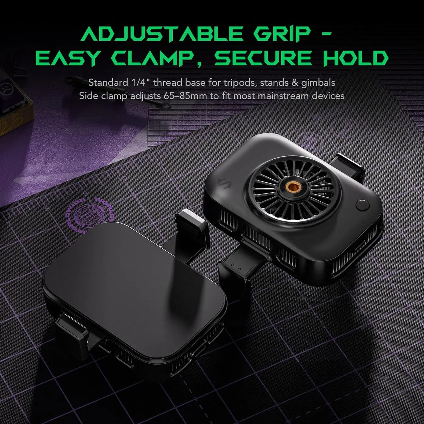 A black adjustable tripod grip accessory with a small built-in fan, shown alongside its matching black clamp base on a dark gridded mat. Green text at the top reads 'ADJUSTABLE GRIP - EASY CLAMP, SECURE HOLD' with smaller descriptive copy.