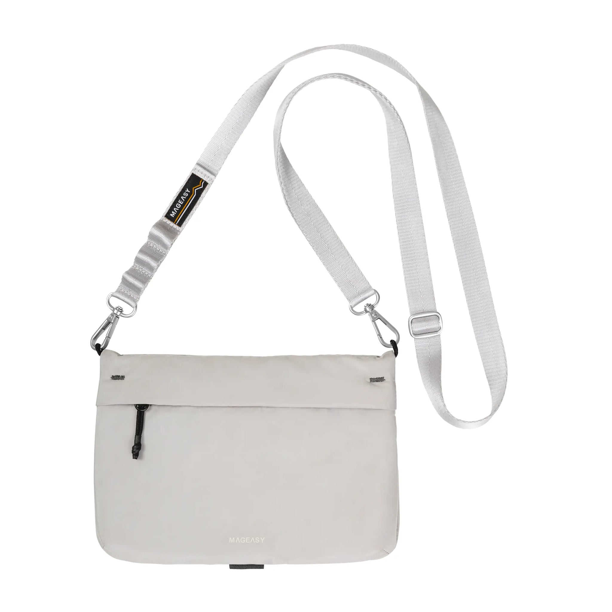 A light gray crossbody bag with a matching adjustable shoulder strap, featuring a zippered front pocket and a small black and yellow brand tag.