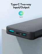 Black power bank with Type-C inputs and outputs on a light blue background