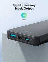 Black power bank with Type-C inputs and outputs on a light blue background